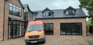 This Image shows a Celsius Home Improvements van in front of a new build home where Celsius Home Improvements installed all of the windows and doors. The property is in Aughton, Ormskirk.